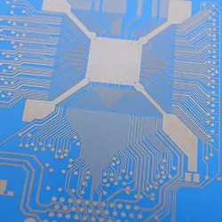 Fan-out pattern of fine conductor lines around a central chip pad