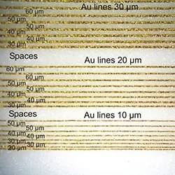 Gold lines of 30, 20 and 10 µm with spaces from 60 µm down to 20 µm, magnified